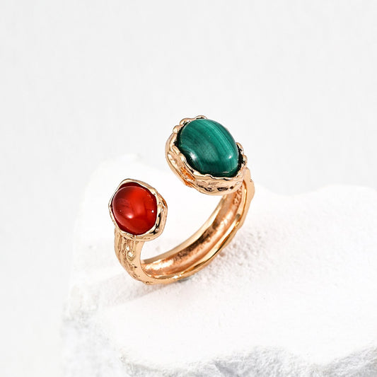 Gold open ring with one green malachite and one red gemstone, elegant handcrafted jewelry