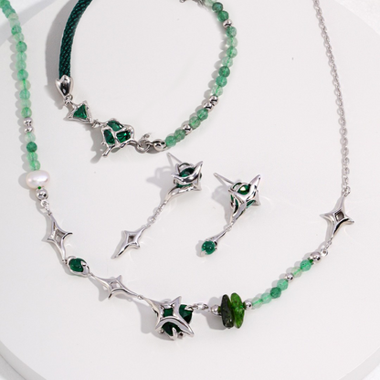 Silver and green gemstone jewelry set with necklace, bracelet, and matching earrings on white background