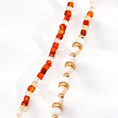 قلادة من العقيق الأحمر والصدف