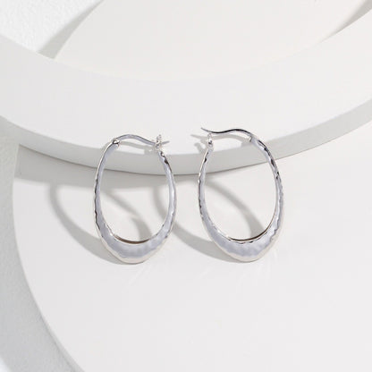 O-shaped silver earrings
